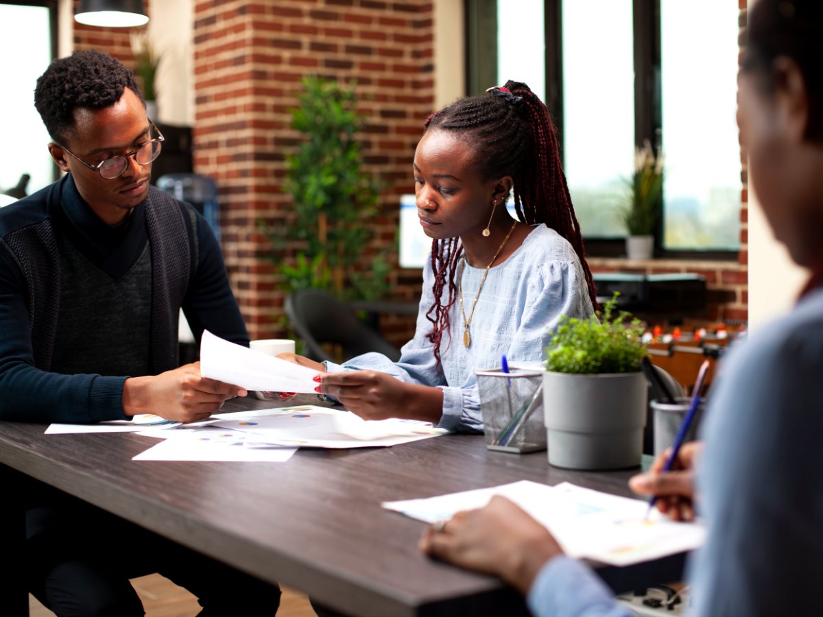A team reviewing management accounts around a table