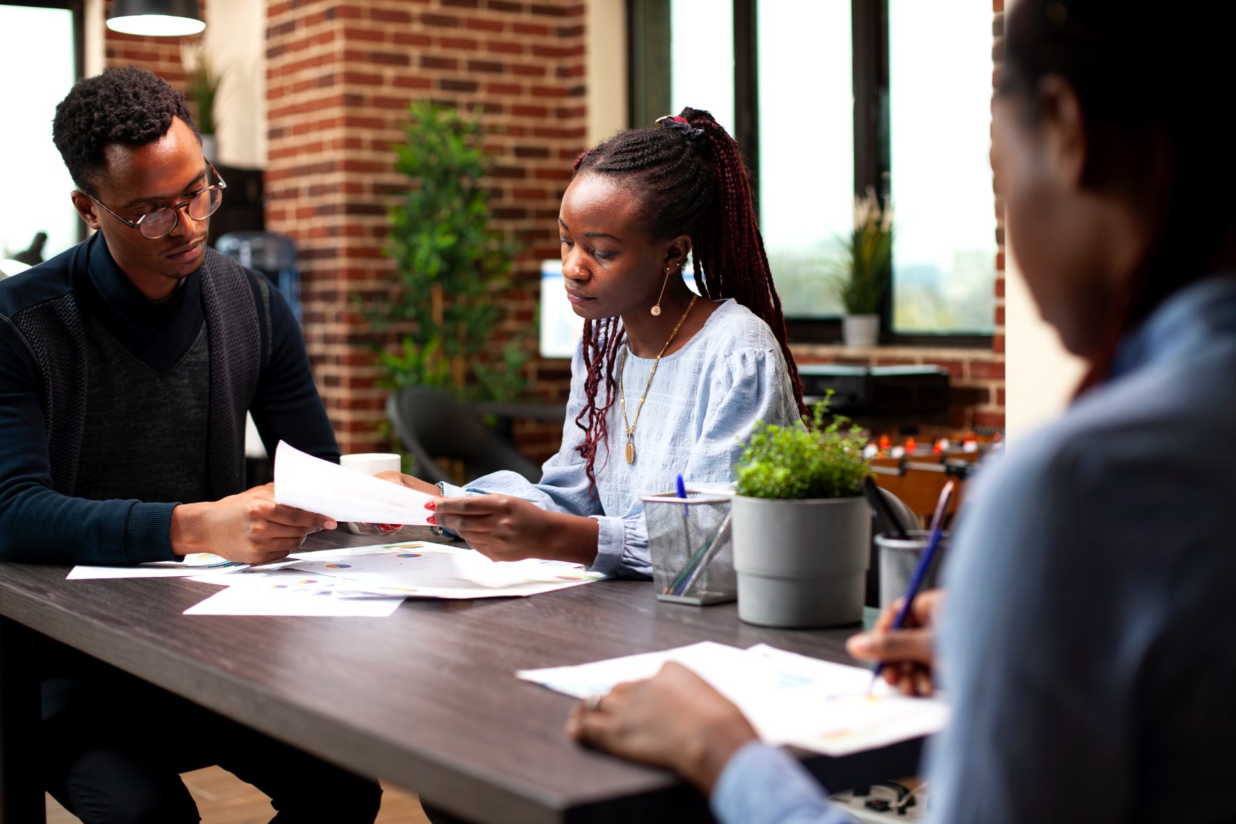 A team reviewing management accounts around a table